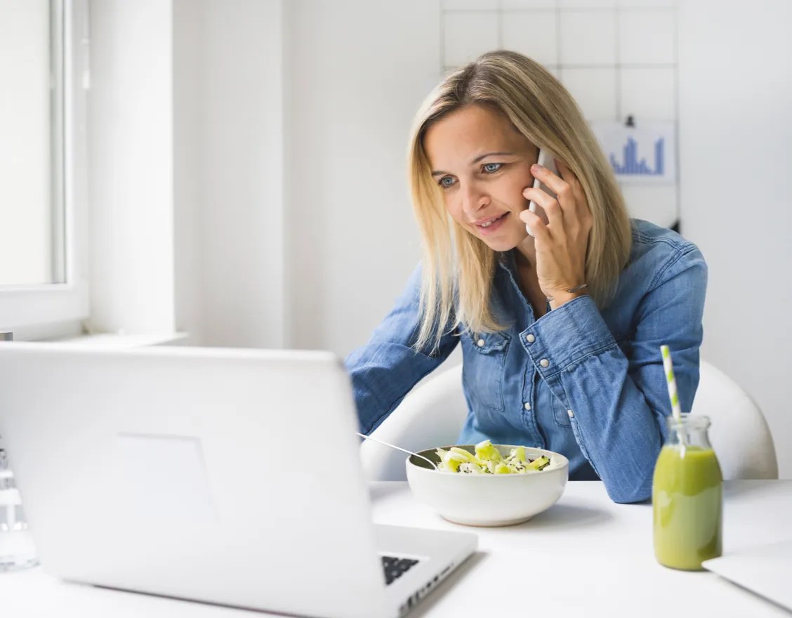 Woman using a laptop to check Woolworths at Work benefits for Shoppers