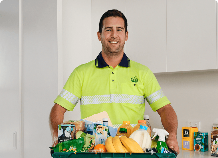 Grocery delivery driver with big box of office supplies and snacks