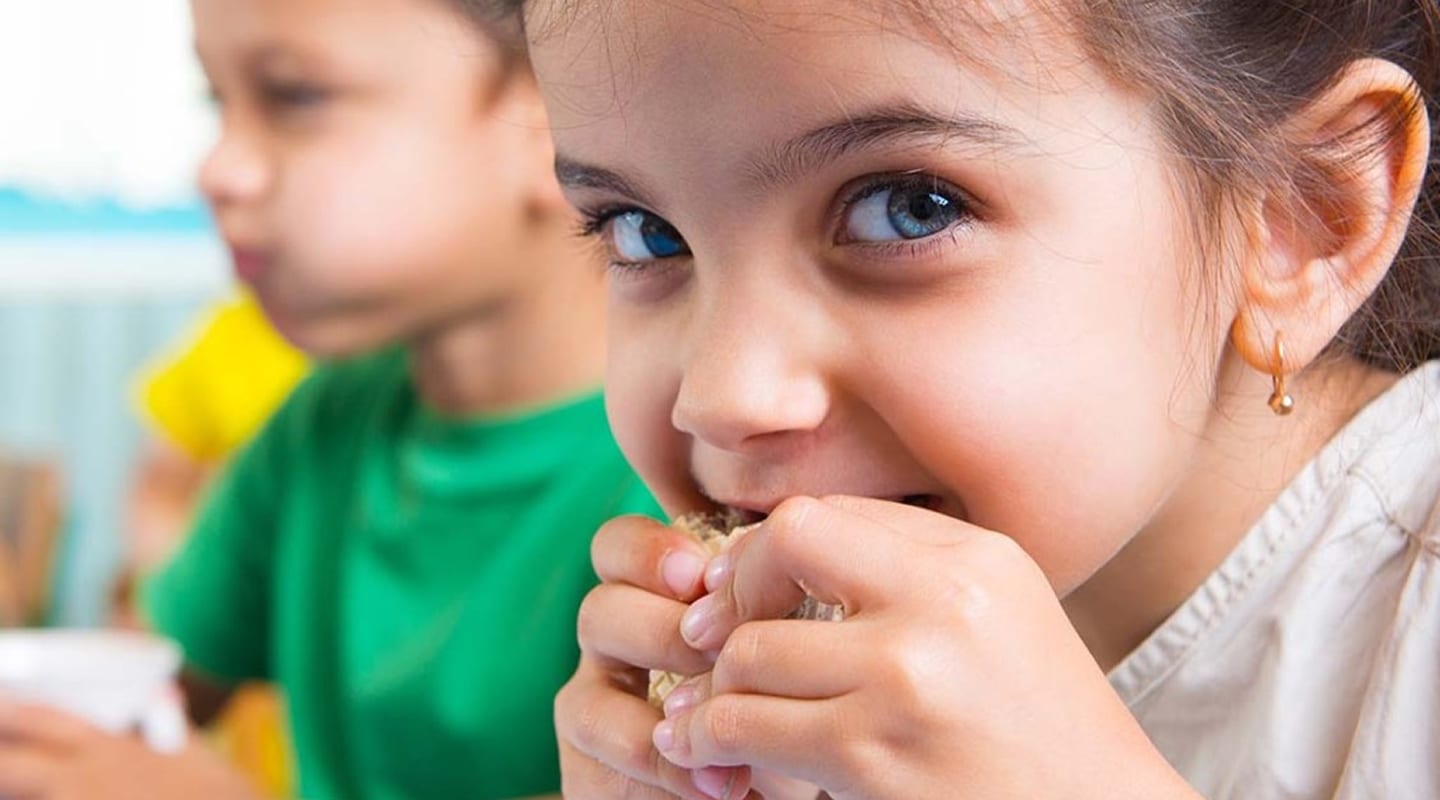 Child eating lunch at daycare